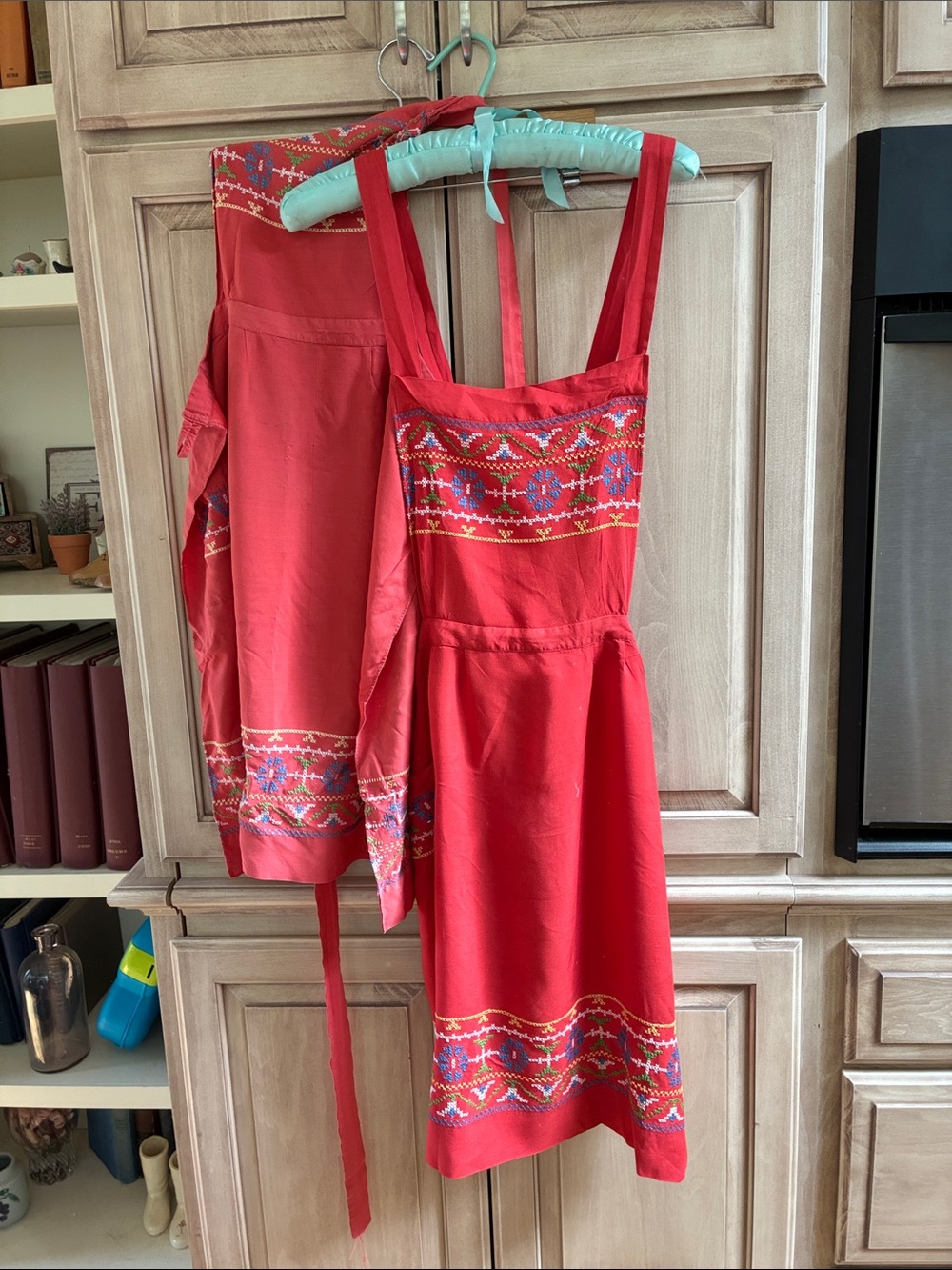 2 Red Embroidered aprons with crisscross Straps vintage